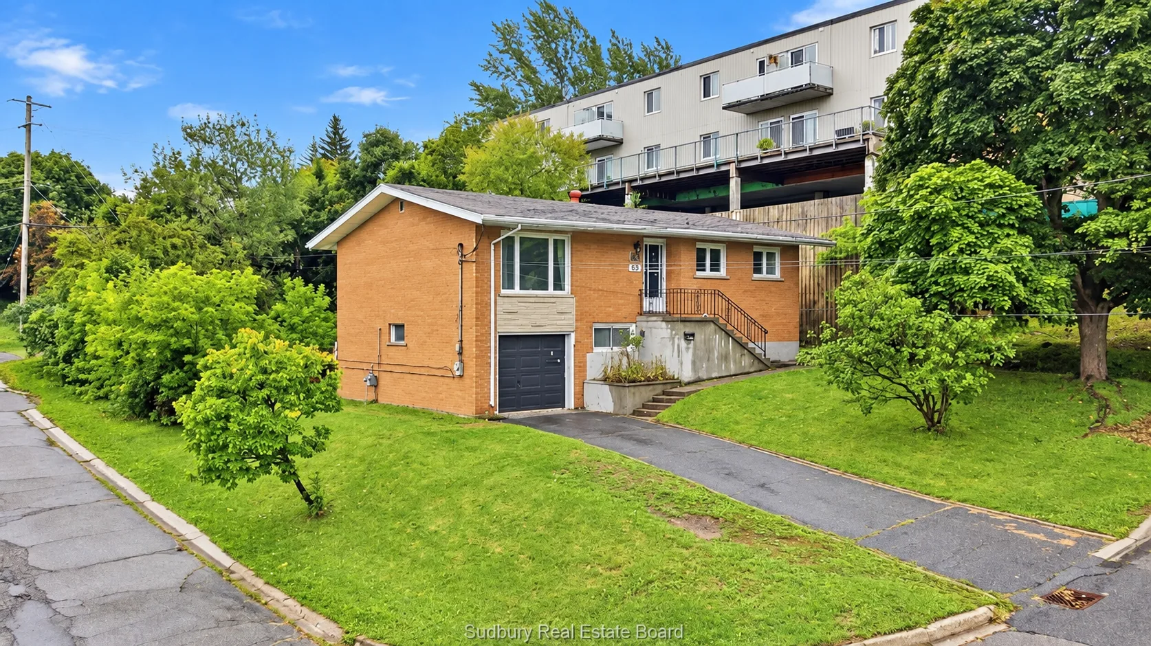 836 Prete Street by day: brick exterior, corner lot and mature trees